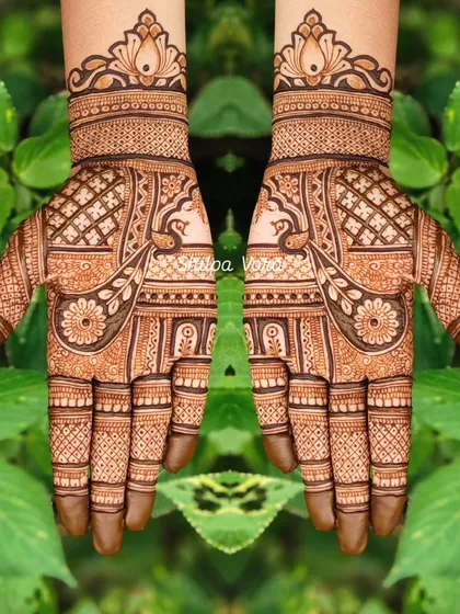 A symmetrical design with peacock and floral motifs, perfect for festivals like Teej.