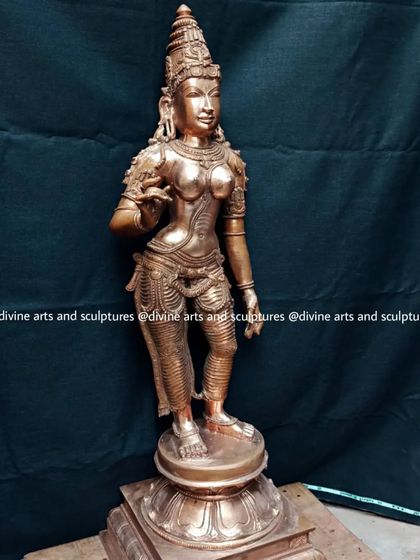 A bronze sculpture of Sivagami, a form of Goddess Parvati, crafted in the elegant Chola style. Her hand mudras (gestures) signify fearlessness and devotion.