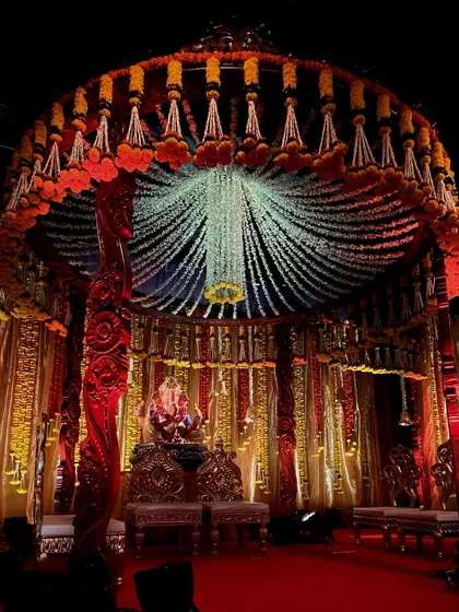 For Ganesh Chaturthi, I designed this magnificent circular mandap. The canopy is made of thousands of hanging jasmine and tuberose strings, creating a divine atmosphere for Bappa.