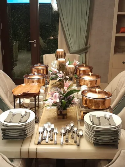 An elegantly set table for an intimate party, showcasing my copper serveware and attention to detail in presentation.
