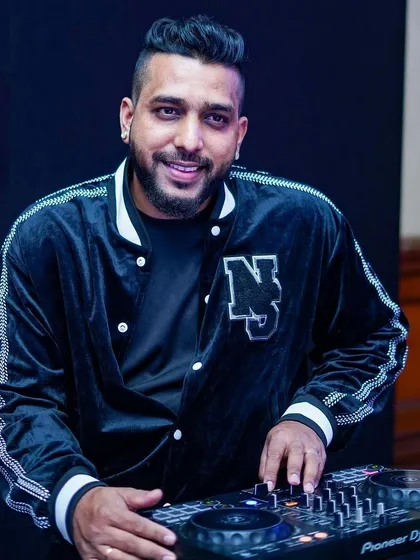 A quick smile between tracks. Whether it's a massive festival or an intimate party, my goal is always to connect with the audience and create a great vibe.