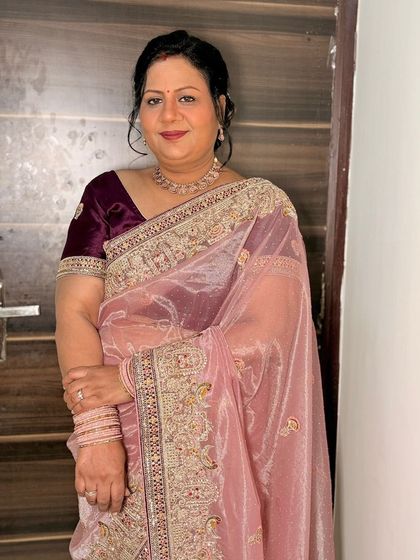 A soft and pretty look for a party, featuring a pink organza saree.