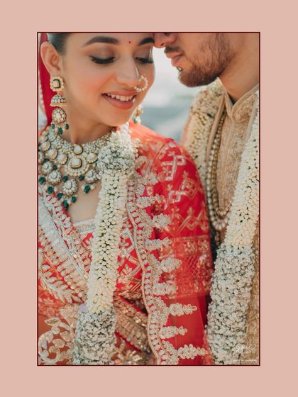 A close-up portrait capturing the bride's joyful smile and the delicate details of her wedding attire. The image radiates warmth and happiness, a perfect memory of their special day.