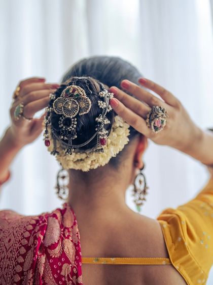 A close-up of the hair adornments and jewelry I chose to pair with the Banarasi Bandhani saree. Accessorizing is key to completing a traditional Indian look.
