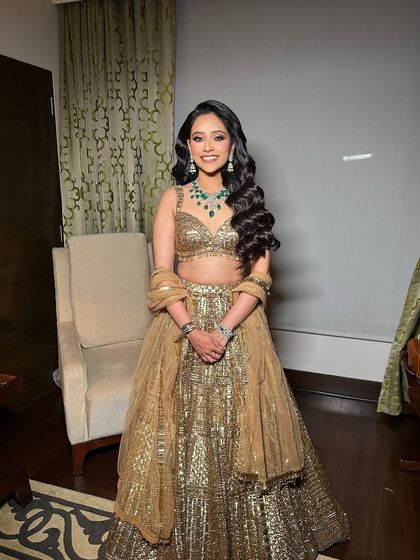 Regal Hollywood waves for a Sangeet night. This style is perfect for creating a royal, high-glamour look, especially when paired with a stunning outfit.
