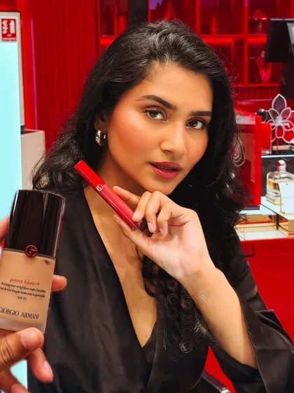 A close-up shot from the Armani Beauty store launch, featuring their Power Fabric foundation and a lip color. I create content that highlights product details in a glamorous setting.