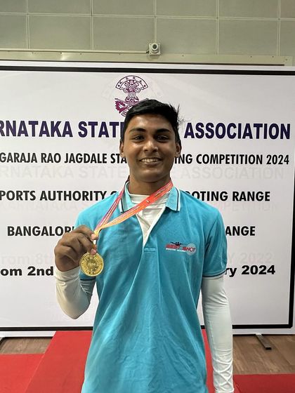 Ronak with his gold medal from the Air Rifle Men's Team event.