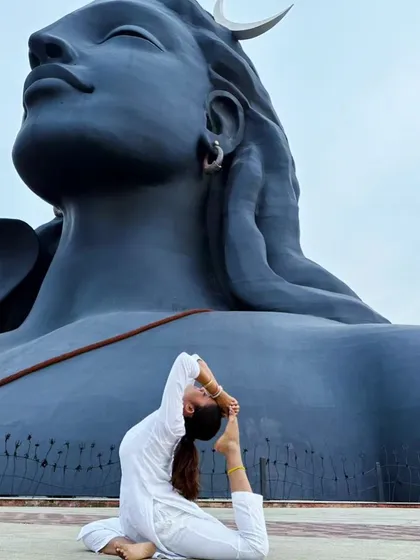 In a posture of surrender and devotion before the Adiyogi. Change is the essence of life, and this pose represents the willingness to surrender what you are for what you could become.