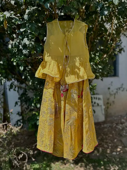 The yellow peplum top lehenga, a perfect blend of modern style and traditional prints.
