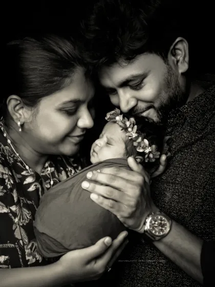 A family portrait is more than a photo; it's a memory of love. In this black and white shot, I wanted to capture the pure emotion and connection as parents gaze at their newborn.