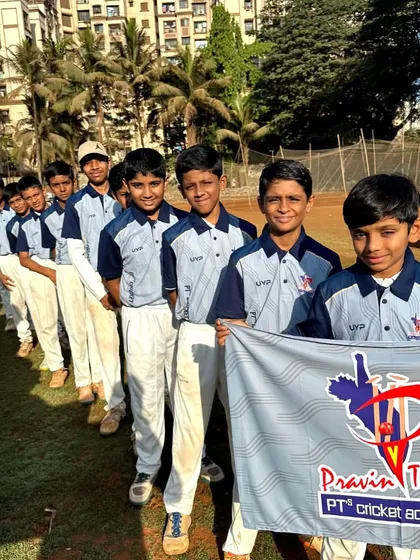 The U-12 Grey Team, standing in line with their team flag, ready for the tournament to begin.