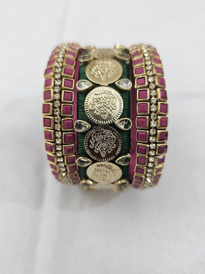 Different angles showcasing the craftsmanship of the green and ruby silk thread bridal bangle set with antique coin details.