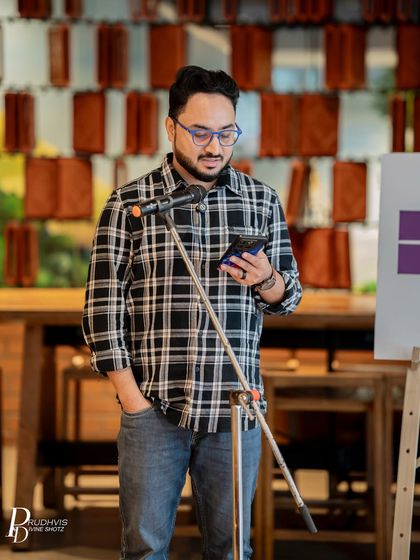 A poet in deep concentration as he reads his piece. Our audience provides a respectful and attentive space for every performer.