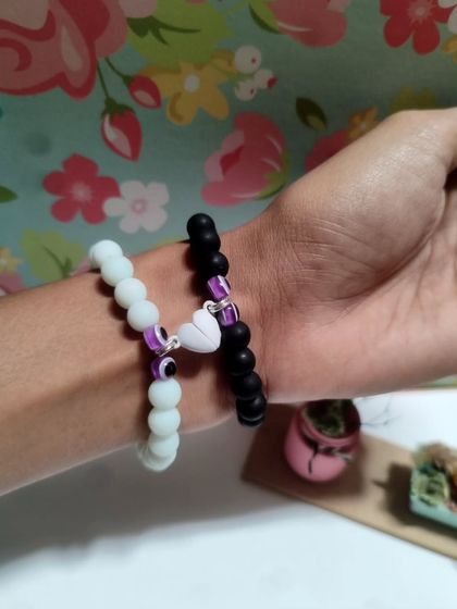 My collection of handmade bracelets, available in many colors and styles. I use beads, evil eye charms, and macrame techniques to create these stackable pieces.