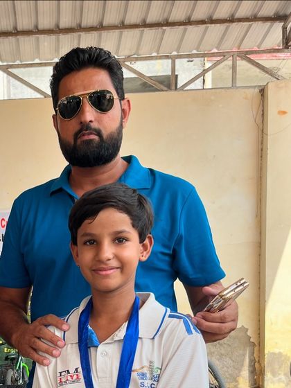 Our coach with Chhaya after a good performance. We are proud of all our players, boys and girls.