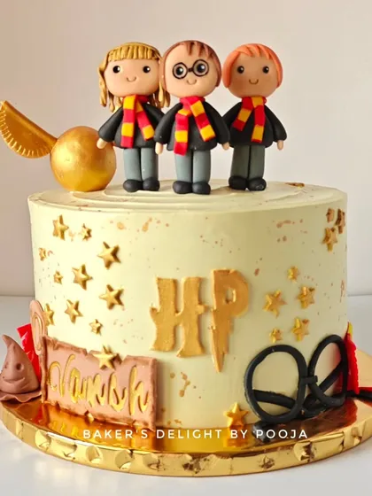 Turning ten is a magical milestone, especially with this Harry Potter themed cake. It features adorable, handcrafted fondant figures of Harry, Ron, and Hermione, along with a golden snitch and other wizarding world details.