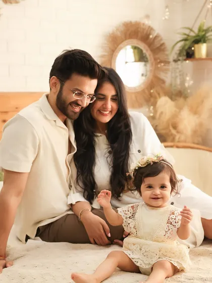 All smiles. This shot perfectly captures the happy and relaxed feeling of our boho-themed family sessions. The genuine smiles and comfortable poses make for a beautiful and authentic family portrait.