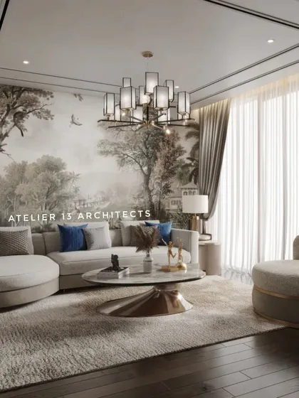 In this living room, we used a large, custom handpainted wallpaper mural to create a dramatic and artistic feature wall. The neutral, curved sofa and armchair are accented with deep blue cushions, set against dark wooden flooring for a sophisticated contrast.