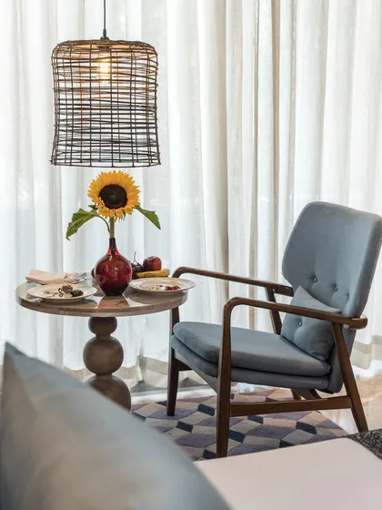 This cozy corner is perfect for your morning coffee or an evening read. I've combined contemporary furniture with thoughtful details like a sunflower to bring a touch of warmth and simplicity to the space.