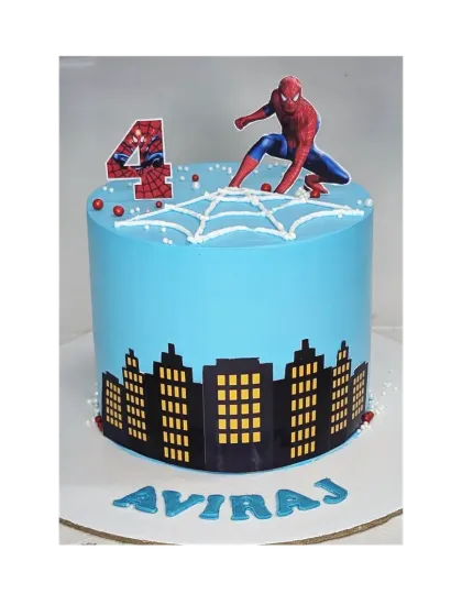 This tall Spiderman cake shows the hero perched above a city skyline. It's an eggless mixed fruit cake, offering a lighter flavor option for a superhero party.