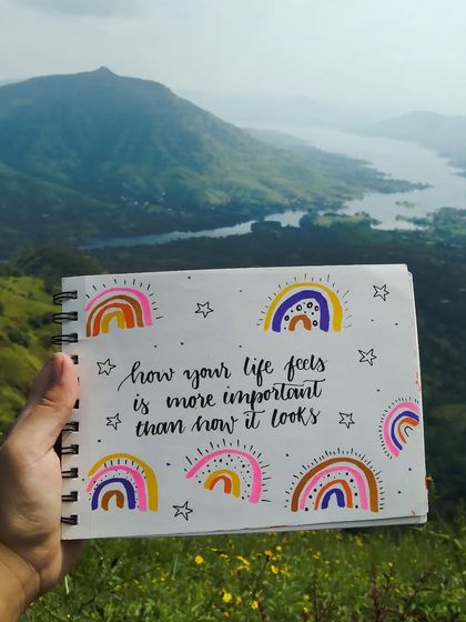 I often take my sketchbook with me on my travels. This entry was created with a beautiful mountain and lake view as my backdrop.