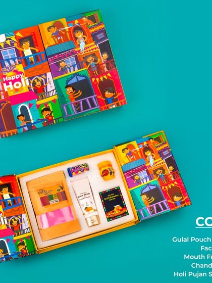 This thoughtful Holi hamper includes pouches of gulal, face wash for post-celebration care, mouth freshener, chandan tika, and Holi pujan samagri, all in a beautifully designed box.