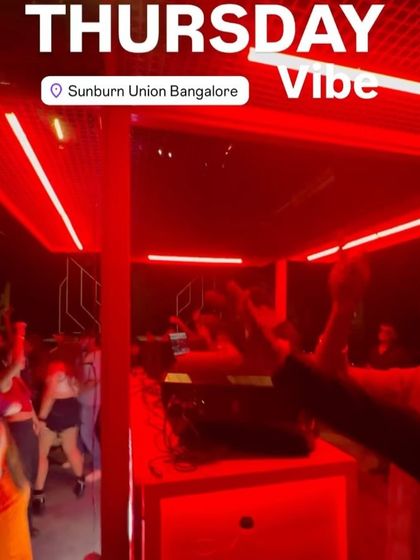 The red neon lights at Sunburn Union create an intense and immersive party atmosphere. Here's a look at the crowd dancing under the glow.