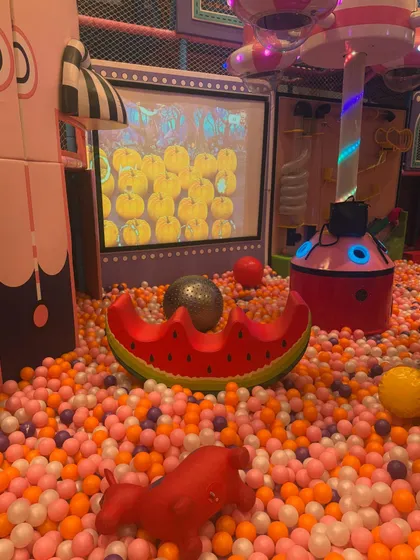 Our ball pit features an interactive screen where kids can play games by throwing soft balls at the targets, combining physical and digital play.