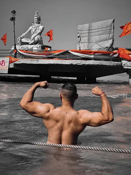 My strength comes from two places: the gym and my faith. Here, flexing in the holy Ganga with the blessings of Mahadev. Physical and spiritual power go hand in hand.