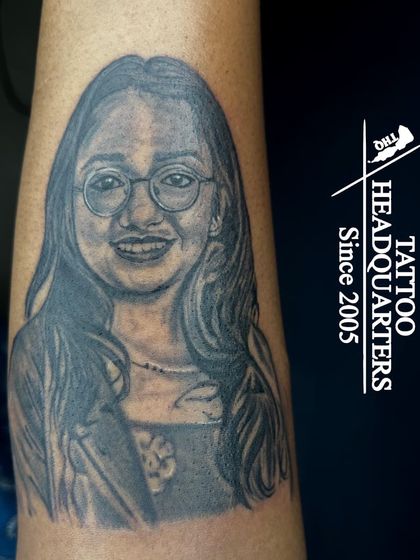 A beautiful and realistic portrait of a young woman with glasses, showcasing our ability to capture personality and fine details in our portrait work.