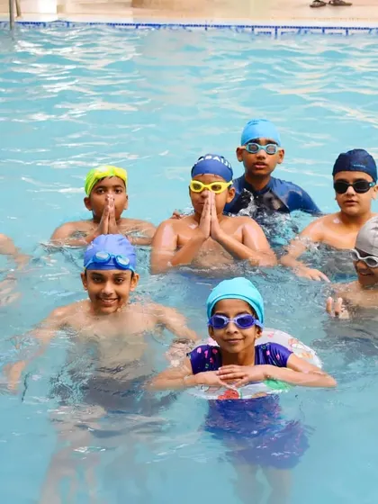 Fun moments after a good practice session. I teach kids to be comfortable and playful in the water, which is key to learning.