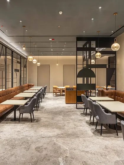 For the restaurant at Park Inn by Radisson in Jalandhar, we crafted a modern and inviting dining experience. The design uses clean lines, warm lighting, and a sophisticated material palette to create a contemporary restaurant ambiance that is both stylish and comfortable for guests.