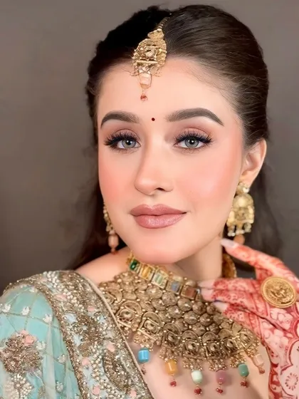 Here’s a close-up of my signature HD makeup, with no filter needed. Notice the smooth, skin-like texture and the soft, blended eyeshadow. This is the flawless finish I promise every client.