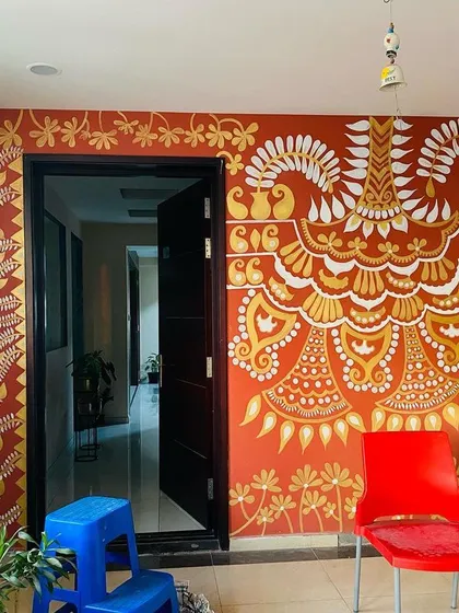 The full view of the 'Ethnic Ether Mural' framing the doorway. It makes for a grand and welcoming entrance, setting a warm and festive tone for the entire home.