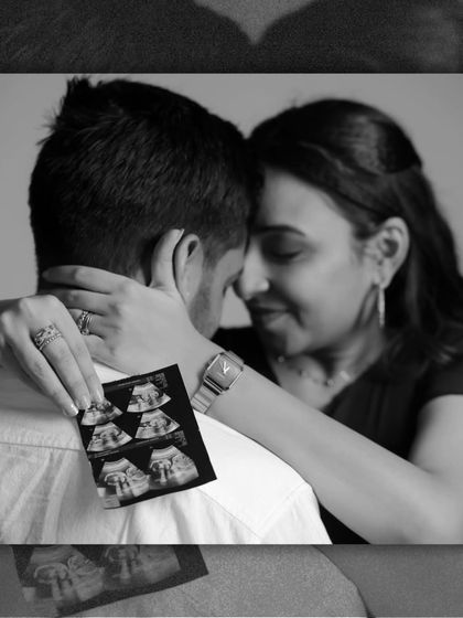 An intimate black and white collage. The focus is on the emotional connection, with the sonogram held gently as a reminder of the little life that is at the center of their love story.