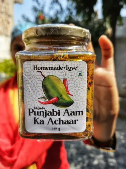 And here is the final product. A jar of our spicy and tangy Punjabi Aam ka Achaar, made from the freshest raw mangoes of the season.