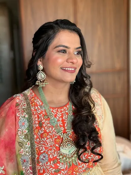 A candid, smiling shot. The client looks happy and confident.