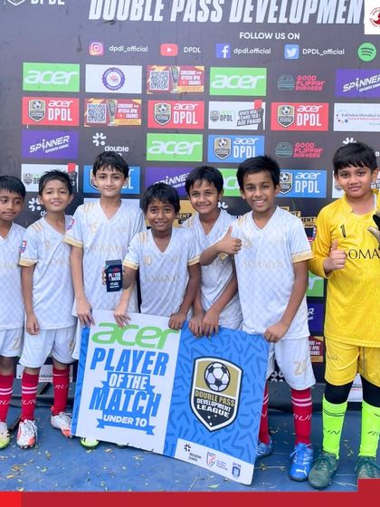 The Somaiya FC U-10 team celebrates a victory, with one player holding the Player of the Match award at the DPDL tournament.
