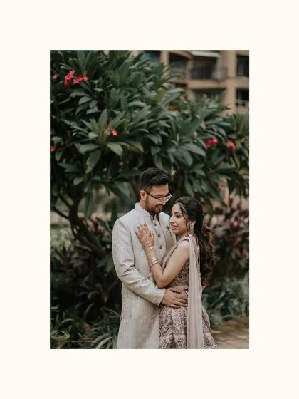 A classic, romantic portrait of the engaged couple. Their gentle embrace and the soft, natural background create a timeless and heartfelt image.
