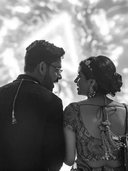 Divya and Saurabh lock eyes while listening to Rahat Fateh Ali Khan in Istanbul. This black and white photo, with its beautiful backlighting, captures a moment of shared, subtle happiness.