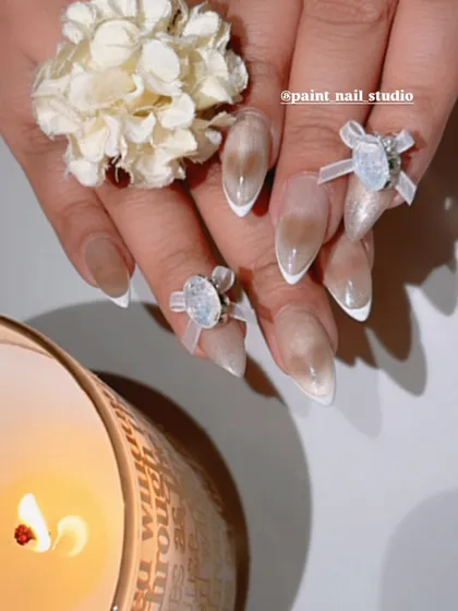 The coquette trend is everything right now, and I’m bringing it to life with these 3D bows. This design features a soft, cat-eye base with a clean white French tip, accented with delicate, hand-sculpted bows and gems. It’s the perfect mix of sweet and sophisticated.