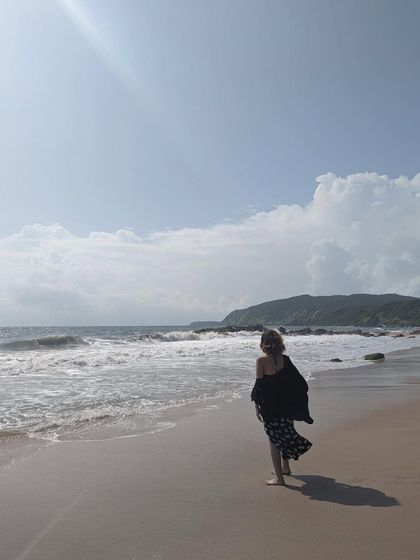 Walking along the shoreline. A breezy, comfortable outfit is essential for enjoying a long walk on the beach.
