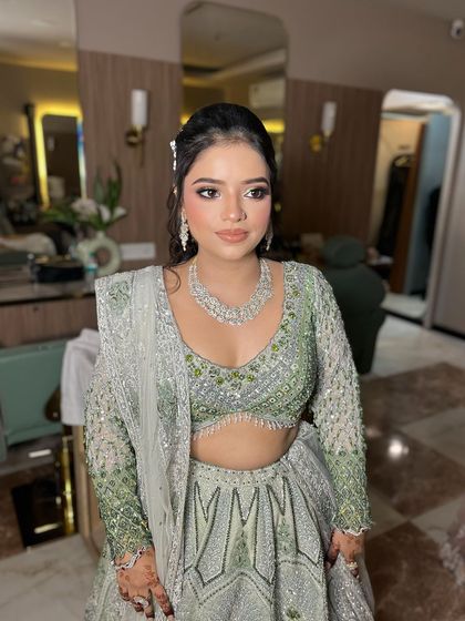 A beautiful soft and sweet celebrity glam look. The mint green and silver lehenga is so unique, and the makeup complements it perfectly.