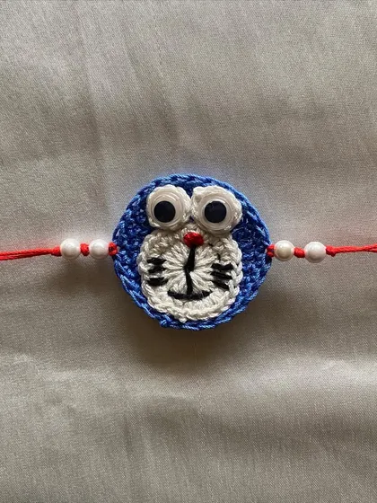 A detailed look at our Doraemon-themed kid's Rakhi. We love bringing favorite characters to life with crochet for special occasions.