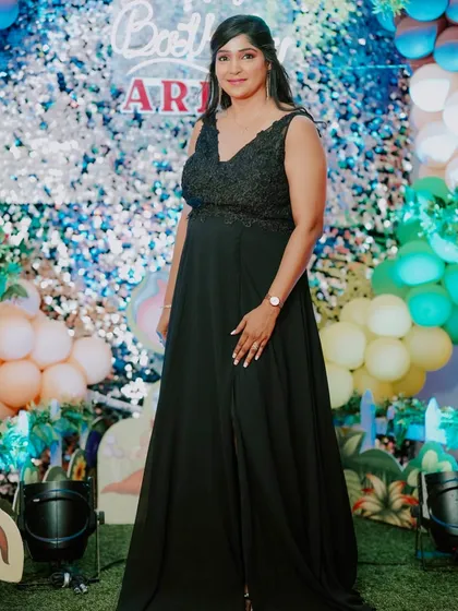 A full-length shot of my client at a birthday party. The glam makeup ensures she stands out in the festive setting.