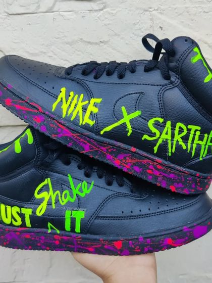 A neon bomb! These black Nike Court Vision Mids were transformed with dripping neon green paint and a pink and purple splatter effect on the midsole. They even glow in the dark.