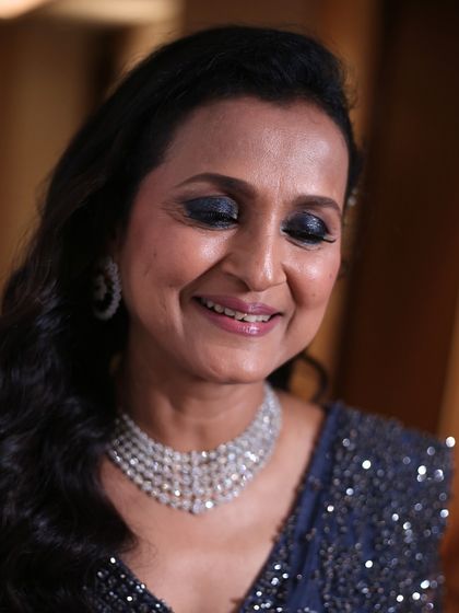 A glamorous smokey eye for the mother of the groom. This close-up with her eyes closed shows the beautiful blending work that creates a dramatic yet sophisticated look.