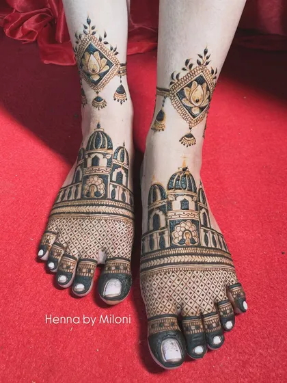 Your bridal look isn't complete without beautiful mehendi on your feet. I designed this intricate pattern featuring architectural domes and delicate lotus danglers to perfectly complement the bride's overall look.