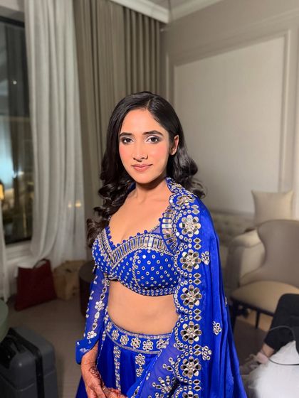 Anmol, looking stunning for her engagement night. The makeup is kept fresh and minimal to let her vibrant blue outfit shine.