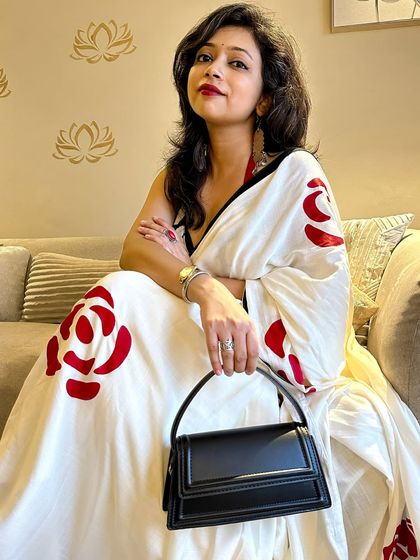 A confident pose showing off the full look. The way you carry yourself is the final accessory to any outfit, especially a powerful saree look like this one.